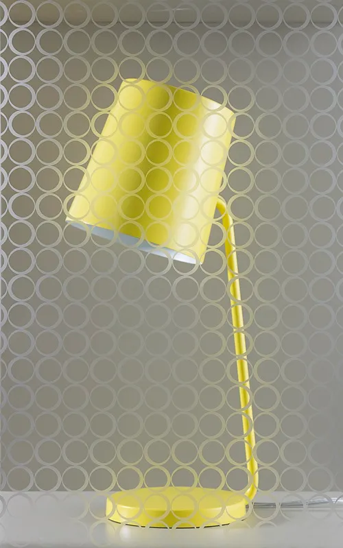 A yellow desk lamp viewed through glass with a repeating circular pattern.